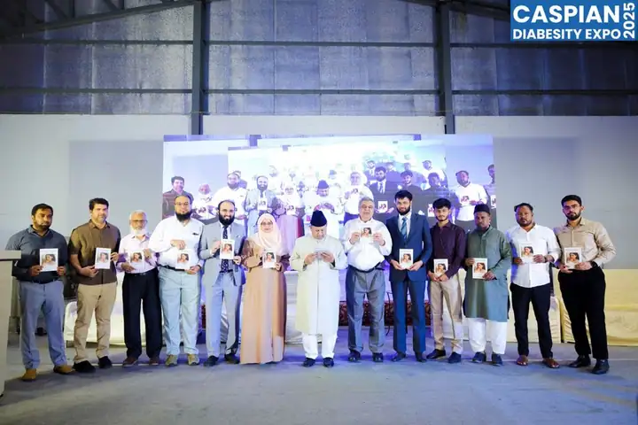 A book being released on stage with guests